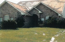 House with damaged roof from a bad storm